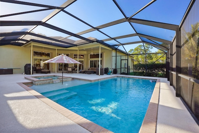 view of pool with a lanai, a patio area, ceiling fan, and an in ground hot tub