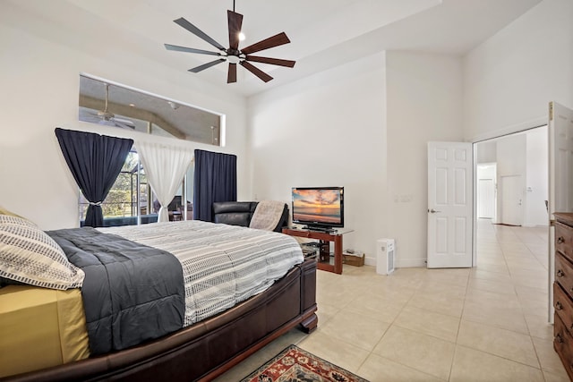 tiled bedroom featuring ceiling fan