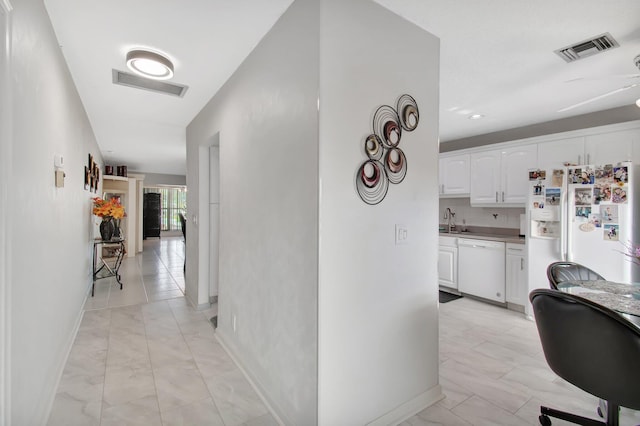 hallway featuring sink