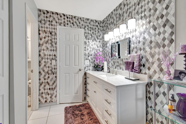 bathroom featuring tile patterned flooring and vanity