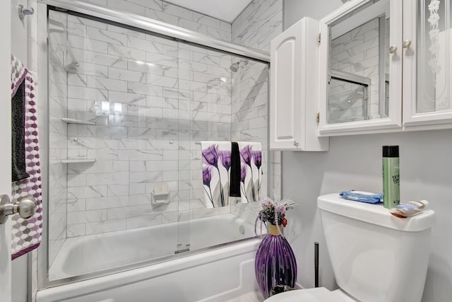 bathroom with enclosed tub / shower combo and toilet