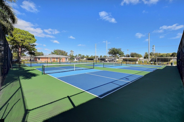 view of sport court with basketball hoop