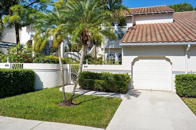 mediterranean / spanish-style home featuring a garage