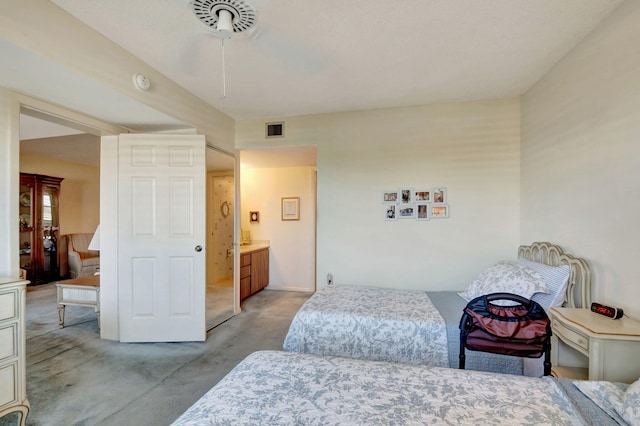 carpeted bedroom featuring connected bathroom