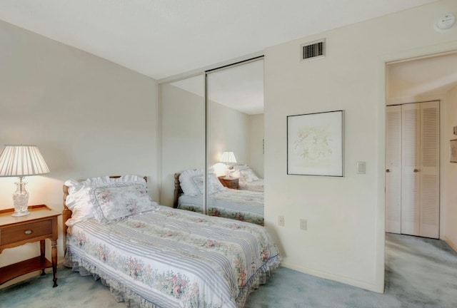 bedroom with light carpet and a closet