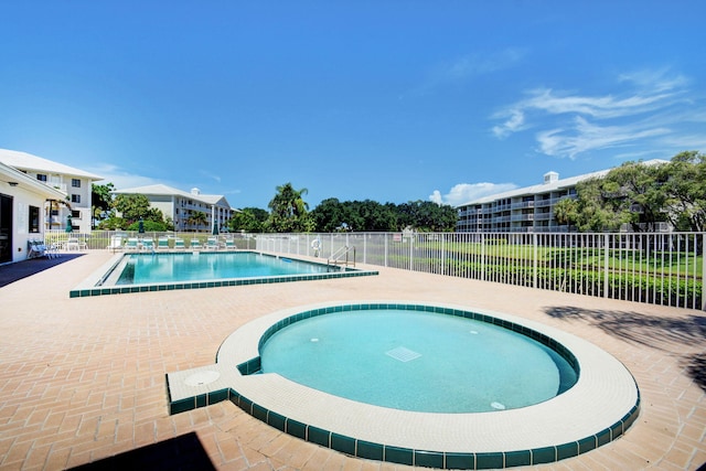 view of swimming pool with a patio area