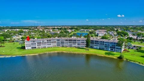 birds eye view of property with a water view