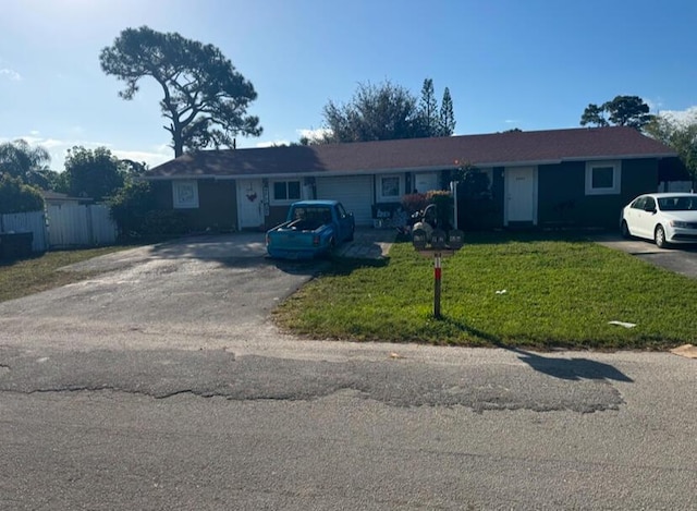 single story home featuring a front yard