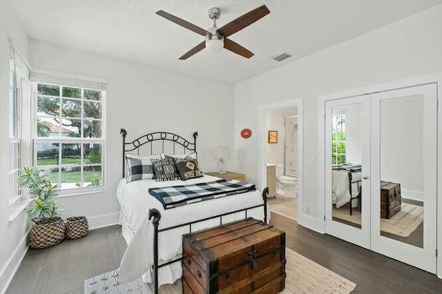 bedroom featuring multiple windows, ensuite bathroom, and ceiling fan