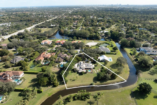 birds eye view of property featuring a water view