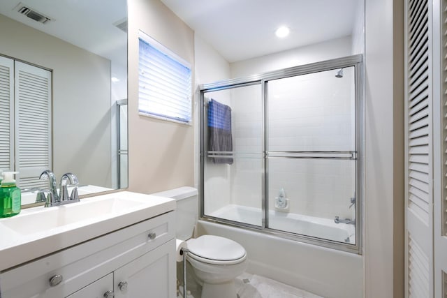 full bathroom with toilet, vanity, and combined bath / shower with glass door