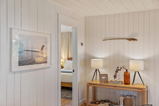 doorway featuring wood walls