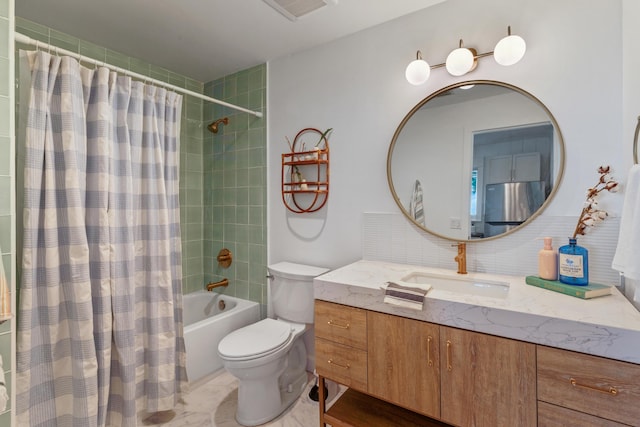 full bathroom featuring shower / bath combo, toilet, backsplash, and vanity