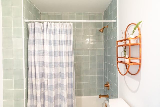 bathroom with shower / bath combination with curtain