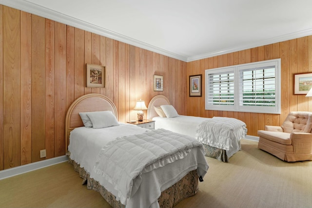 bedroom featuring wood walls, ornamental molding, and carpet floors