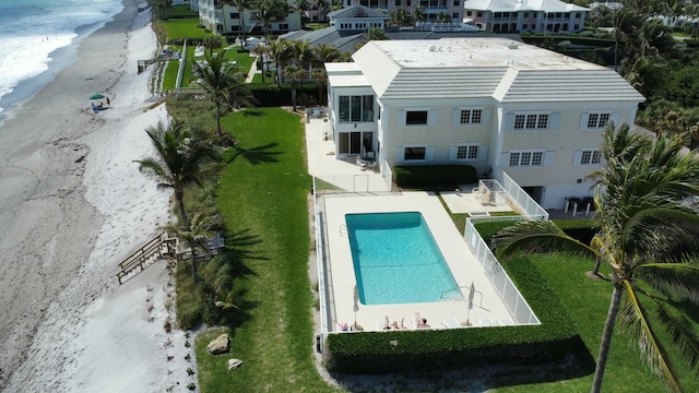 aerial view with a water view and a view of the beach