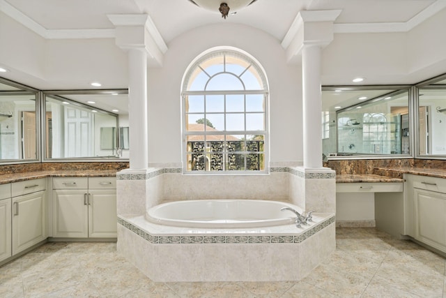 bathroom with tiled bath, ornamental molding, and vanity