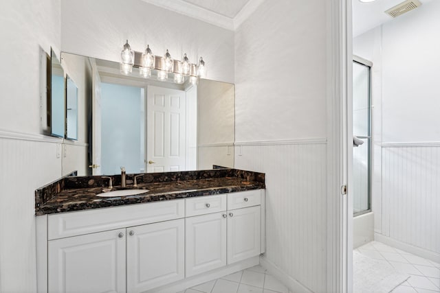 bathroom featuring combined bath / shower with glass door, vanity, and crown molding