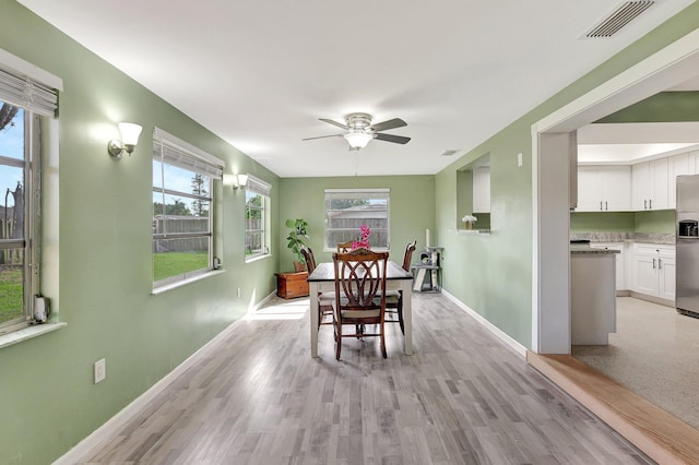 dining area featuring light hardwood / wood-style floors and ceiling fan