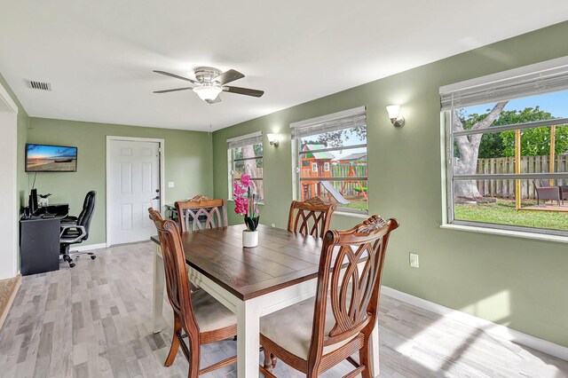 dining area featuring ceiling fan and light wood-type flooring