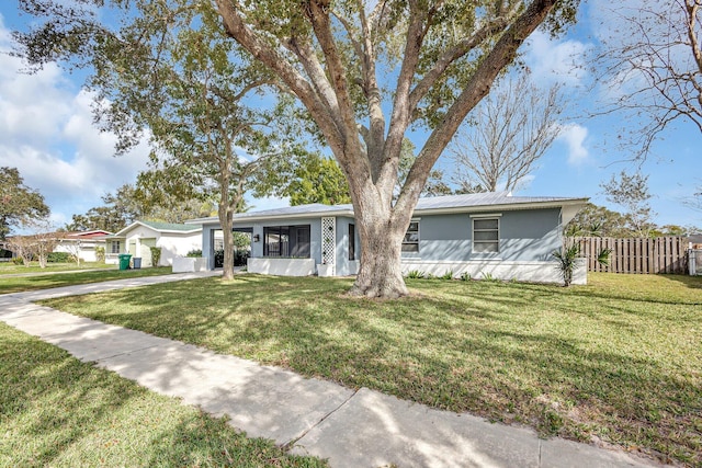 single story home with a front yard