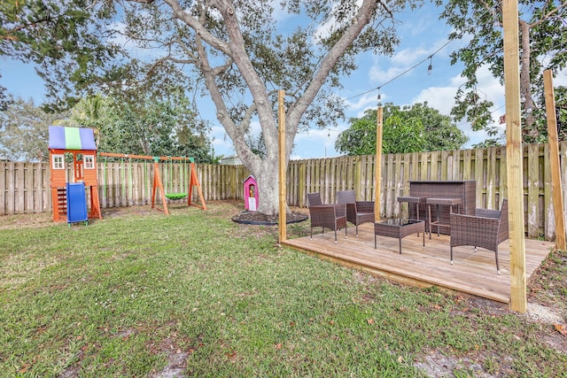 view of yard featuring a playground, an outdoor hangout area, and a deck