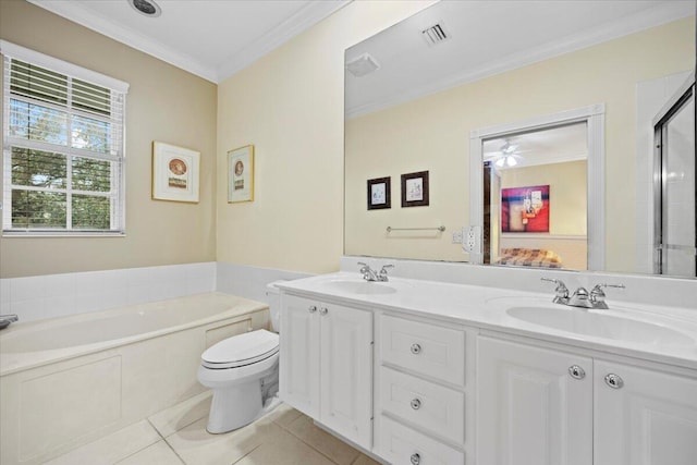 bathroom with tile patterned flooring, vanity, a relaxing tiled tub, toilet, and crown molding