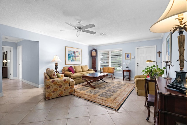 living room with a textured ceiling, visible vents, crown molding, and light tile patterned flooring