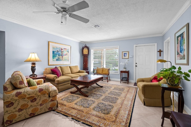 living room with a textured ceiling, ceiling fan, light tile patterned floors, and crown molding