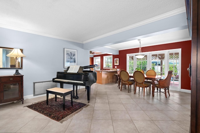 misc room with light tile patterned floors, a textured ceiling, and ornamental molding