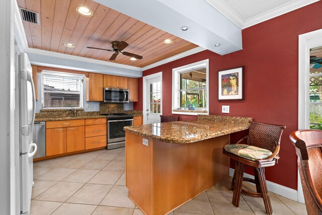 tiled dining area with crown molding, french doors, ceiling fan, and a textured ceiling