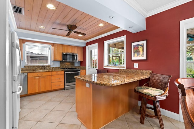 kitchen with kitchen peninsula, stone counters, stainless steel appliances, and wooden ceiling