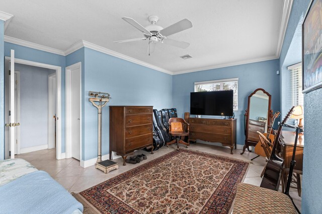 bedroom featuring baseboards, tile patterned flooring, and crown molding