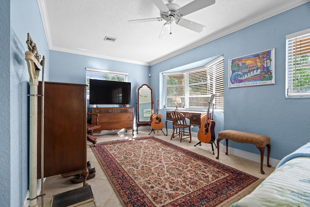 tiled bedroom with a textured ceiling, a textured wall, visible vents, baseboards, and ornamental molding