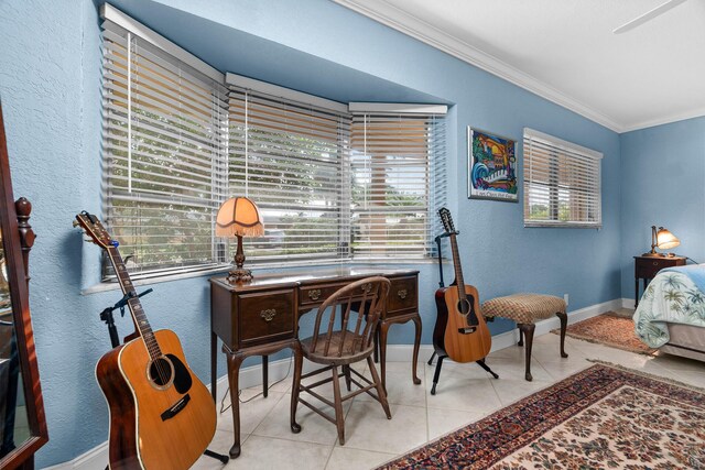 office with a textured wall, ornamental molding, tile patterned flooring, and baseboards