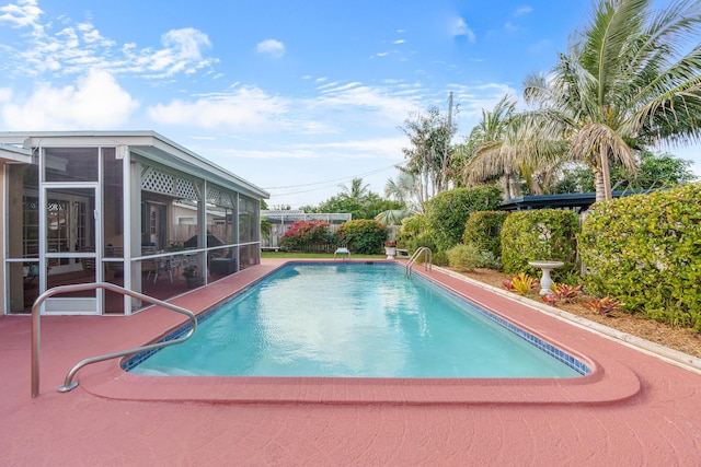 view of swimming pool featuring a patio and a fenced in pool