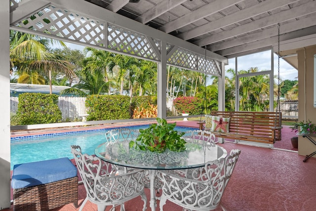 sunroom with beamed ceiling