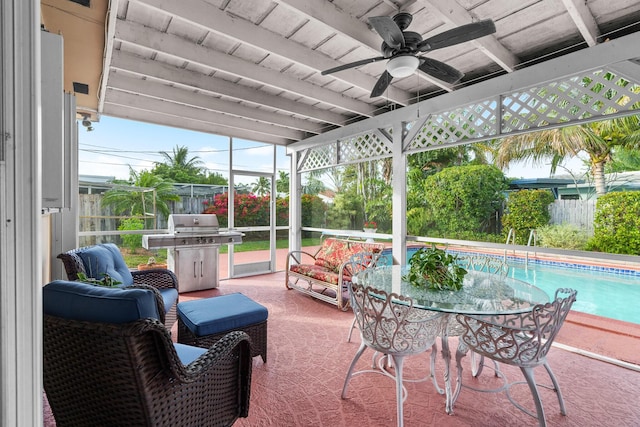 sunroom with beamed ceiling and ceiling fan