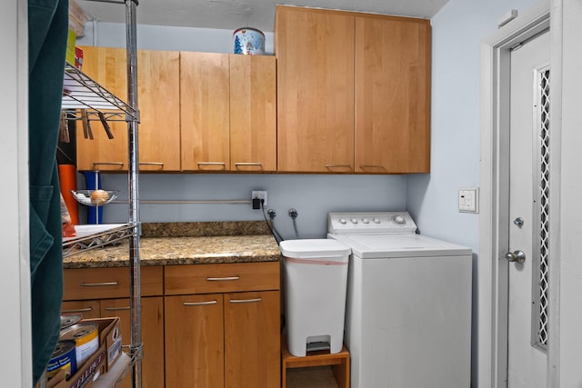 laundry area with washer and clothes dryer and cabinet space