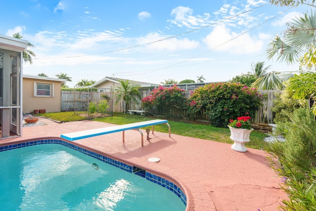 view of pool with a fenced in pool, a fenced backyard, and a patio