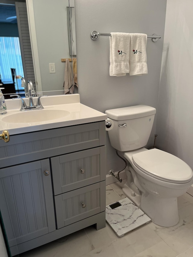 bathroom with vanity and toilet