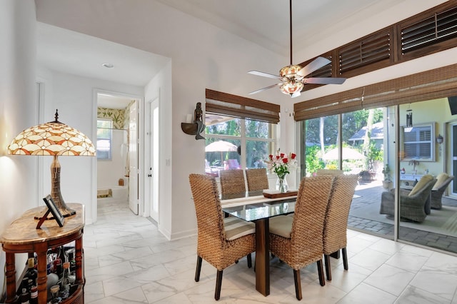 dining area with ceiling fan and plenty of natural light