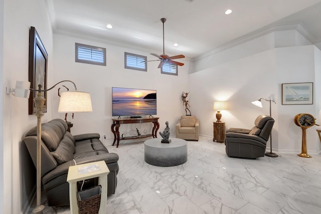 living room with ceiling fan and crown molding