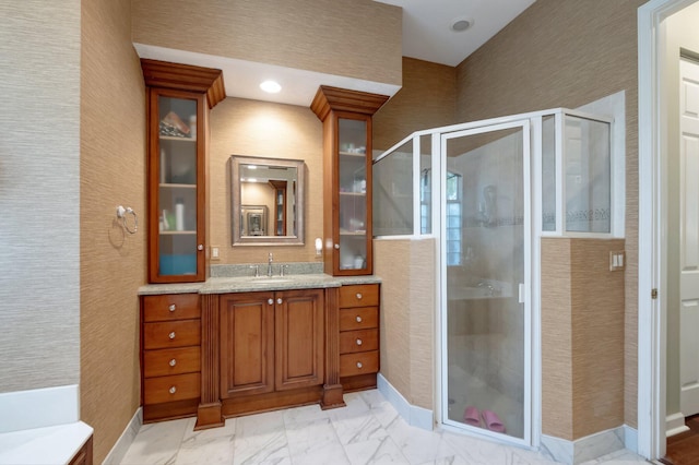 bathroom with vanity and an enclosed shower