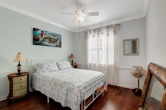 bedroom featuring crown molding, ceiling fan, and dark wood-type flooring