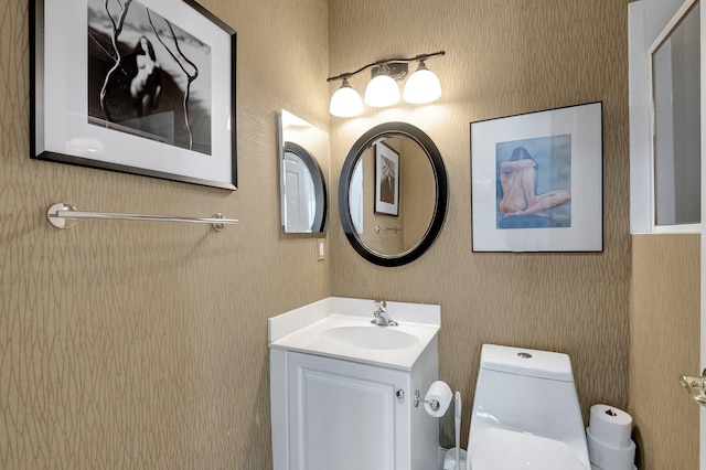 bathroom with vanity and toilet