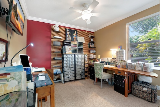 office area featuring ceiling fan, ornamental molding, and light carpet