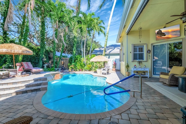 view of swimming pool featuring a patio area and pool water feature