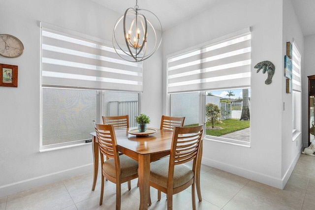 tiled dining area with an inviting chandelier