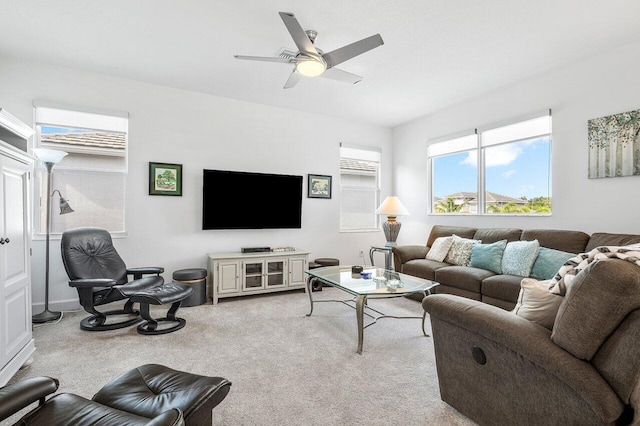 living room with ceiling fan and light carpet